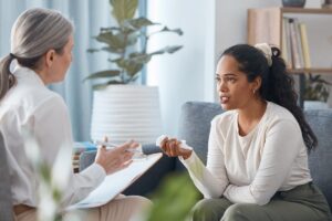 a woman notices positive change since beginning cognitive behavioral therapy