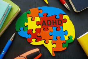 puzzle pieces make up the brain of a person with adhd