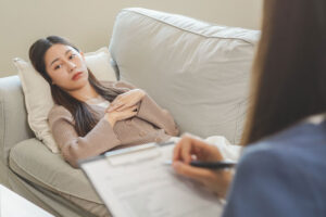a woman opens up in a therapy counseling session