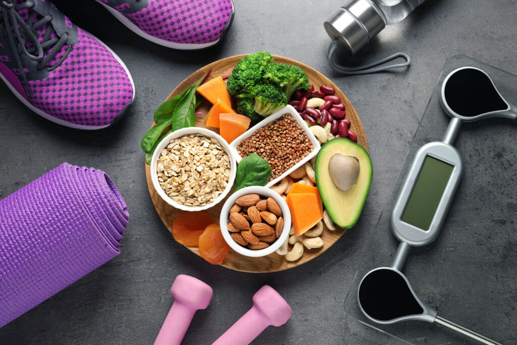 a healthy meal surrounded by exercise equipment