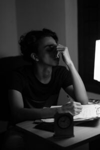 A woman sitting at a desk in front of a computer